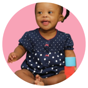 Child smiling over pink background