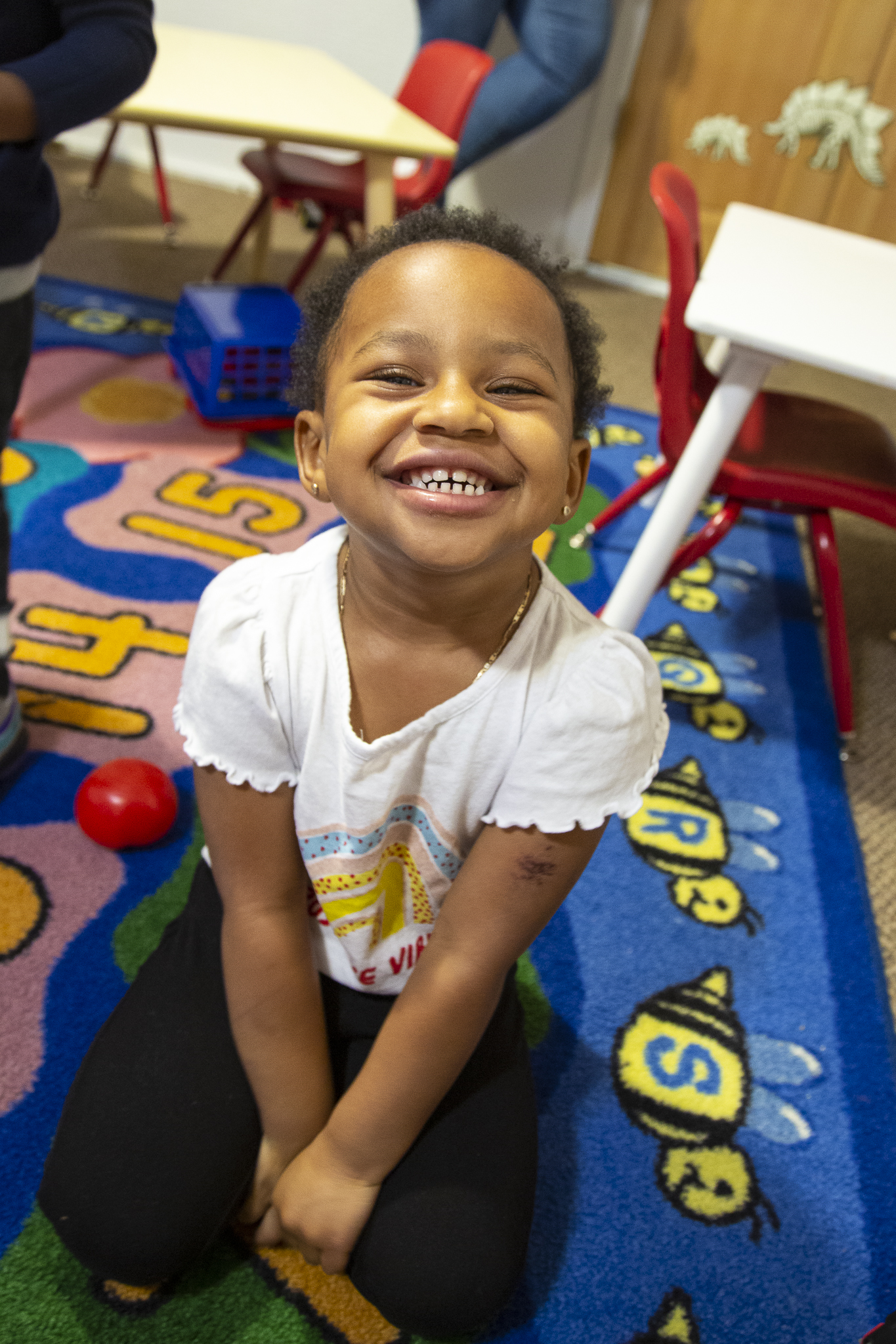 Child smiling in classroom