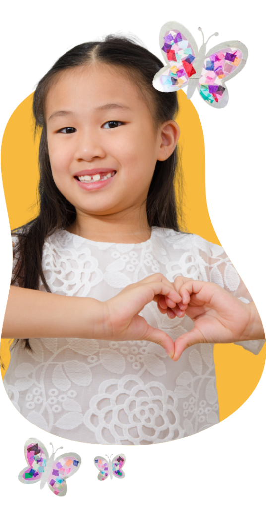 child makes heart shapes with hands