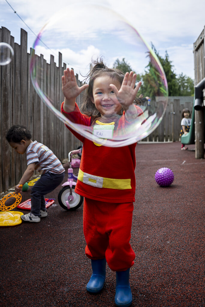 child plays with bubble