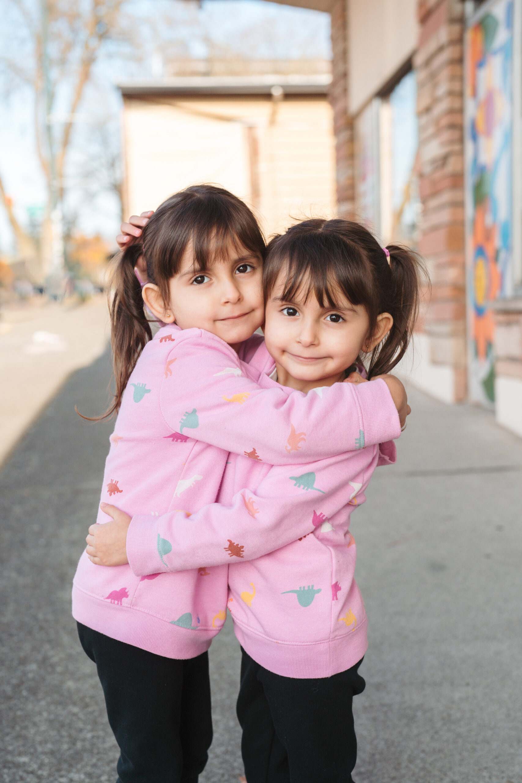 Twin girls hugging