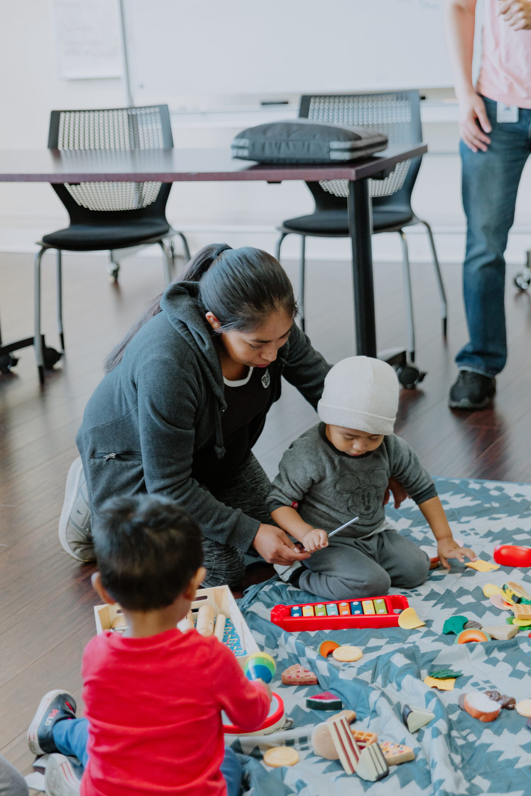 Woman playing with a small child
